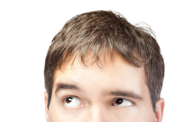 Fototapeta premium attractive young man looking up isolated on white background