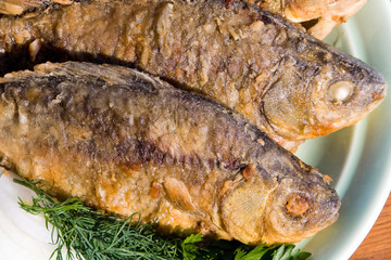 Fried fish carp in plate