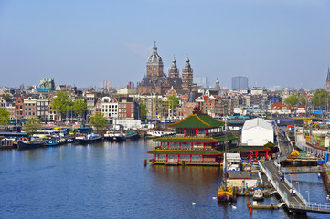Classical Amsterdam view. Boat floats