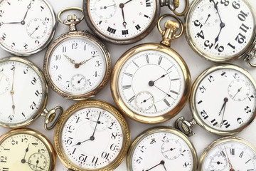 Various Antique pocket watches on white