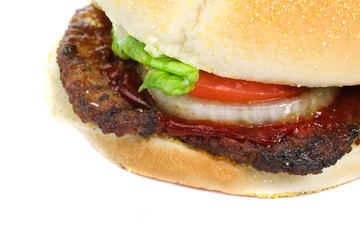 Hamburger with lettuce, tomato and onion isolated on white