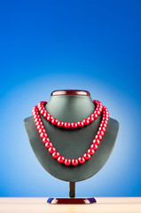 Pearl necklace against gradient background