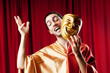 Actor with maks in a funny theater concept - obrazy, fototapety, plakaty