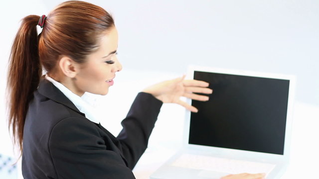 Adorable business woman sitting at the fornt of computer