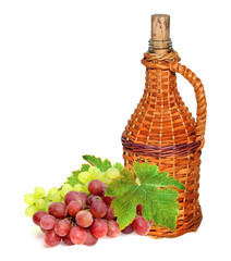 Grapes and a bottle of wine isolated on white