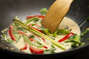 Spicy thai curry in wok