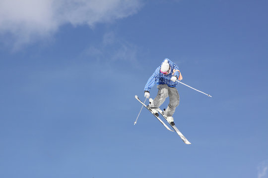 flying skier on mountains, in the sky