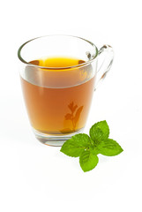tea in glass cup with fresh mint leaves