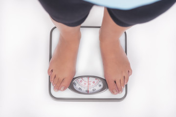 weight scale and woman's feet on it
