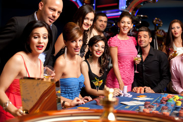 happy people excited about roulette bet outcome