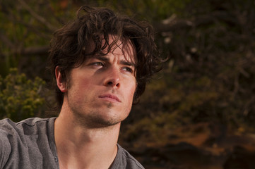 Young man deep in thought