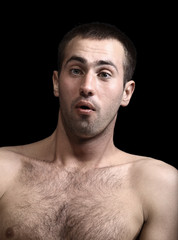 young man face expressions over black background