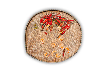 Dry chilli and prawns on a bamboo plate