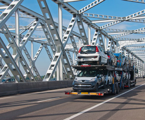 Car transport over an old Dutch bridge