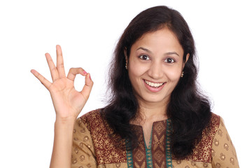 Young Beautiful Girl making Ok sign