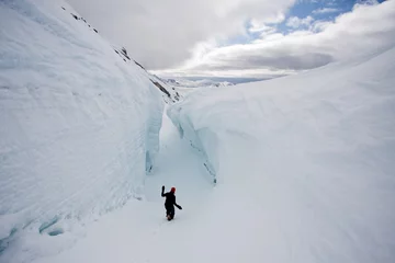 Rolgordijnen Inside the deep glacie crevasse © Incredible Arctic