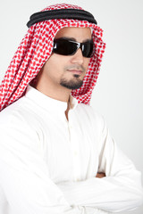 Portrait of a young arab man wearing sunglasses