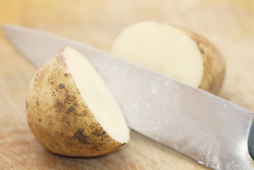 Fototapeta na wymiar One Kestrel potato cut in half.