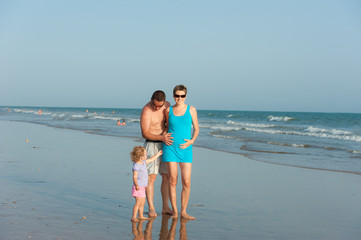 Little baby is having fun with parent ocean