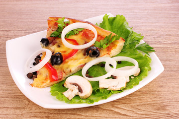 tasty pizza with olives on a wooden background