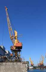 Fototapeta na wymiar lifting cranes in port