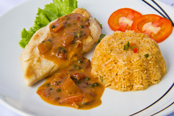 Chicken steak with fried rice close up