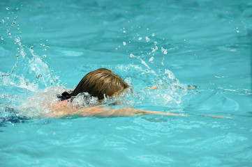 swimmer face down in a swimming pool
