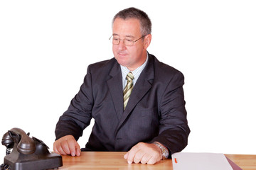 Geschaeftsmann wartet auf Anruf