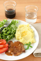 Fried pork with sauce and mashed potato