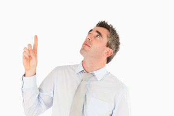 Business manager pointing at a copy space