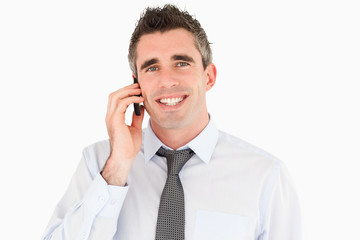 Smiling man making a phone call