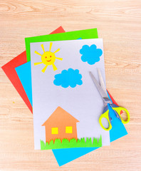 funny children's applications and scissors on wooden background