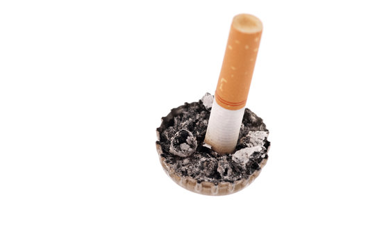 Cigarette butt and ash in a bottle cap
