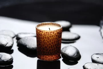  Aromatherapy candle burning over stones in a spa © Mee Ting