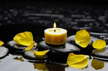  spa scene -aromatherapy candle and petals on zen stones © Mee Ting