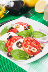 Caprese salad with mozzarella, tomato and basil