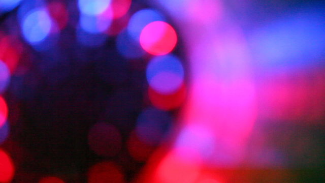 abstract flashing multicolor light in camera blur