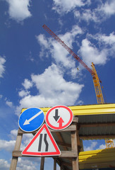 The warning signs and a crane