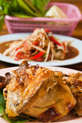 Fresh barbecue chicken,Thai papaya salad and vegetable on the ta