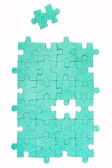 Green puzzle with missing piece