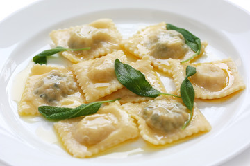 homemade ravioli pasta with sage butter sauce , italian food