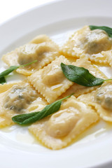homemade ravioli pasta with sage butter sauce , italian food