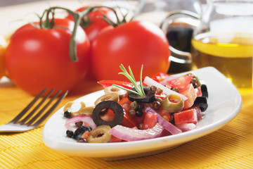 Fresh salad with tomato and olives