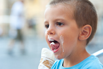 Little kid eating ice cream. © pio3