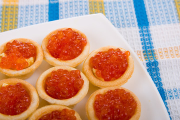Tartlets with red caviar