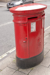 A British Oval Red Post Box designed for two classes of mail