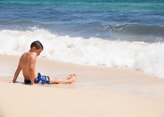 Fototapeta na wymiar boy on a beach