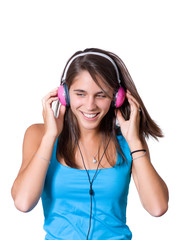 Cute young woman with headphones dancing on music