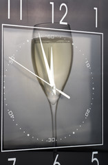 Reflection of wine glass in clock