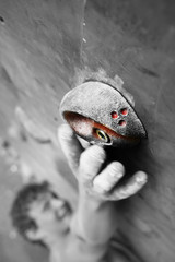 Young man climbing an indoor wall
